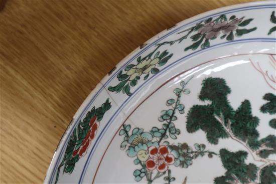 A Chinese famille verte dish, Kangxi period, D. 36cm, cracked